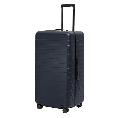Image of Away Trunk Checked Luggage - 31-Inch Lightweight Hardside Suitcase with 360 WhisperGlide Spinner Wheels, Interior Compression System, TSA-Accepted Lock - Navy Blue