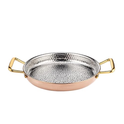 Plat à paella espagnole or rose pour repas convivial à la maison