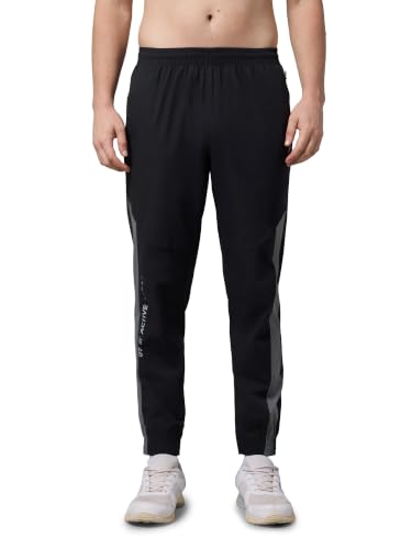 Image of TECHNOSPORT Men's Regular Fit Joggers with Zip Pockets, TECHNOLITE Quick Dry Stretchable Lightweight Track Pants for Gym Running and Casual Wear