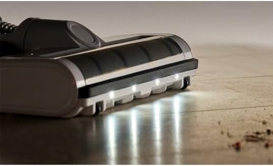 Close-up of the EZIclean Cyclomax R22 Station brush head with LED lights illuminated on a floor.