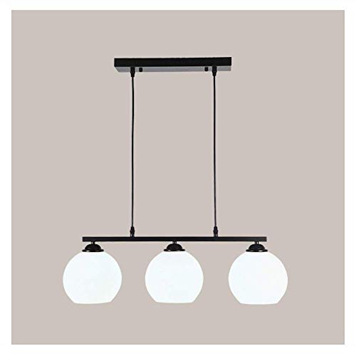 Lustre suspension bar et table à manger en verre transparent
