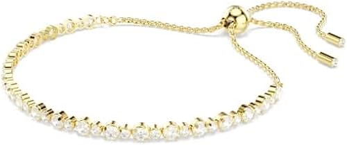 Swarovski Bracelet Tennis de la collection Matrix, avec une alternance de petits et moyens cristaux incolores de taille ronde, fermoir boule coulissante, placage de ton or - 2