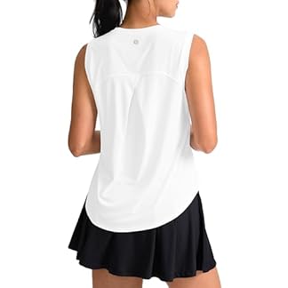 A rear view of a woman wearing a sleek white women's workout tank top, paired with a black athletic skirt. The tank top features a breathable design and a subtle logo, perfect for an active lifestyle, showcasing its versatility and modern fit.