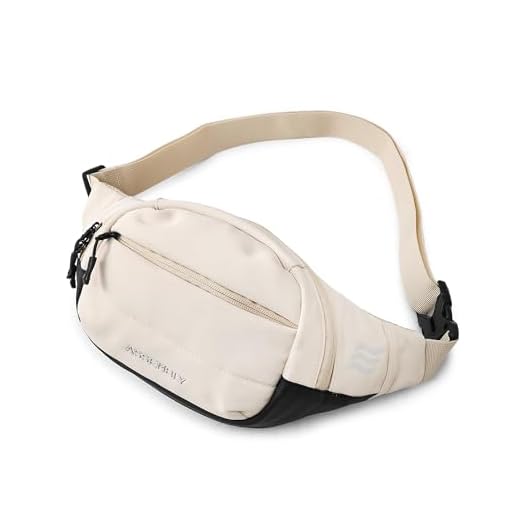Assembly Unisex Cross Body Fanny Pack with Adjustable Strap (38.5 cms) | Padded Waist Bag with Zipper Pockets for Comfort Travel -Float(Cream)