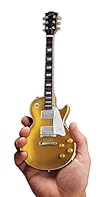 Officially licensed Gibson 1957 Les Paul Gold Top Mini Guitar Model Each Axe Heaven miniature replica guitar is 1:4 scale and is individually handcrafted from solid wood, with metal tuning keys Each guitar model is approximately 10" in length and com...