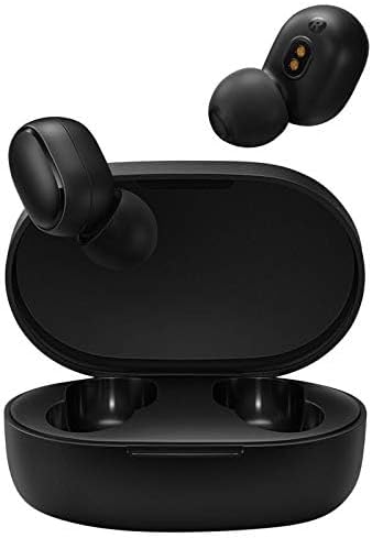 Two black Xiaomi Redmi Airdots earbuds resting inside their open black charging case, showing the charging contacts.