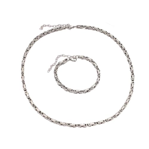Collier et bracelet double chaîne épaisse : vos bijoux acier tendance au bureau