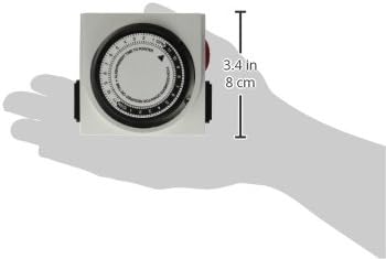 Hand holding Titan Controls Apollo 8 Mechanical Timer, showing dimensions