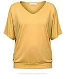 Top uni à manches courtes offrant une silhouette fluide et décontractée grâce à son volume chic et son tissu souple.