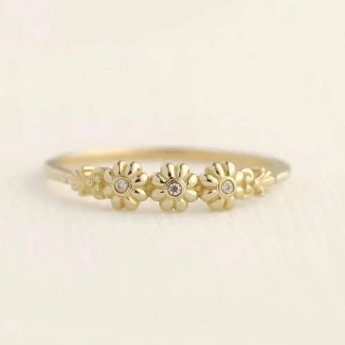 Bijoux party : bague fleur dorée et pierre blanche pour vos soirées