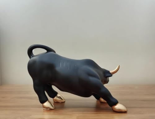 Image of UAG Exports Black Matt Charging Bull Statue with Golden Eyes | Geometric Polyresin Bull Idol for Stock Market Decor, Office Desk, Trader Room Showpiece & Business Gifting (9 Inch)