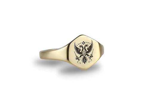 Bague symbole ancien avec aigle héraldique gravé sur chevalière hexagonale