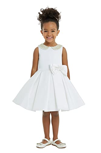 Con una gonna gonfia e un grande fiocco sul retro, questa bambina sarà pronta a colpire il suo palcoscenico della moda.