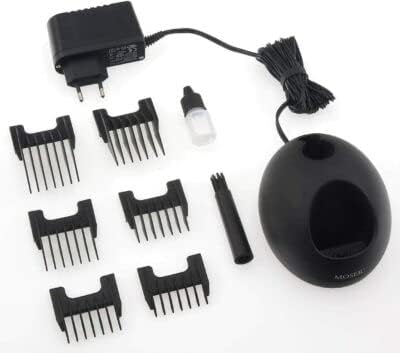 MOSER Li+Pro Hair Clipper kit laid out, showing the clipper, charging stand, power adapter, combs, oil, and brush
