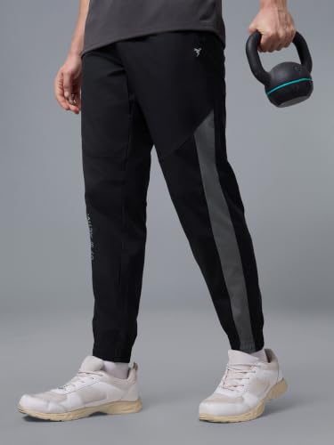 Image of TECHNOSPORT Men's Regular Fit Joggers with Zip Pockets, TECHNOLITE Quick Dry Stretchable Lightweight Track Pants for Gym Running and Casual Wear