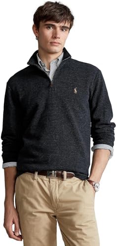 Stylish man wearing a classic quarter-zip sweater over a collared shirt.