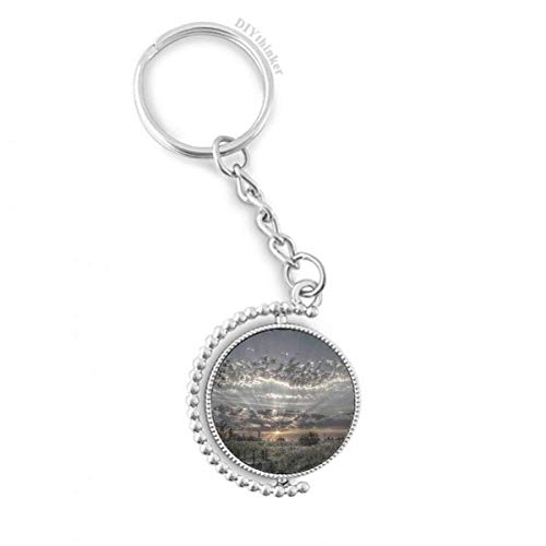 Llavero giratorio de acero y diseño de cielo gris oscuro con nubes blancas de alta resistencia