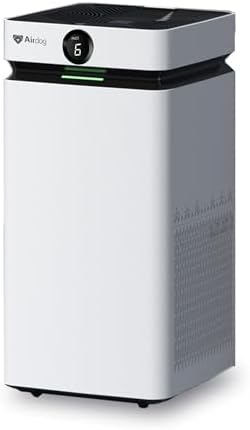 Airdog X8 air purifier showing the sleek white tower design and the digital air quality display in a modern living room setting.