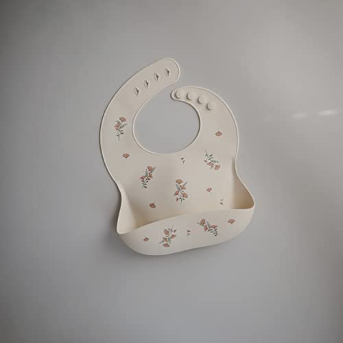 Image of mushie Silicone Baby Bib | Adjustable Fit Waterproof Bibs (Pink Flowers)