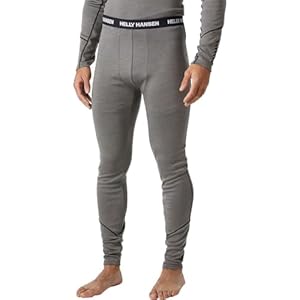 The bottom half of a man wearing gray base layer bottoms.