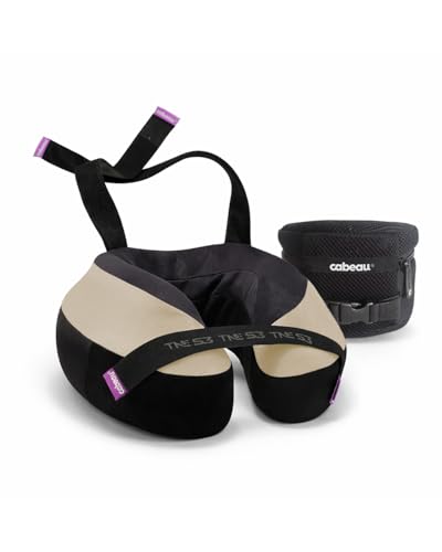Tan horseshoe travel neck pillow with seat strap and compression case — the strap system that anchors it to a seat back