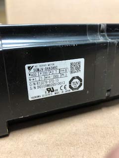 Samping view of the Yaskawa SGMJV-04A3A6C AC Servo Motor, showing the product label with model number, voltage, and power ratings.