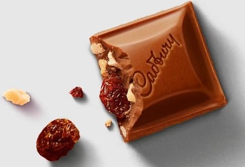 Image of Cadbury Dairy Milk Fruit & Nut Chocolate Bar - 110g By COUGAR | Milk Chocolate with Raisins & Almonds | Classic Fruit & Nut Flavour | Rich & Creamy Cadbury Treat (IMPORTED)