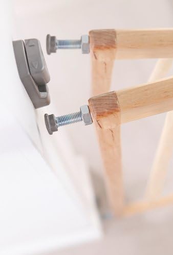 Close-up of a wall mounting screw being secured into a wall bracket.