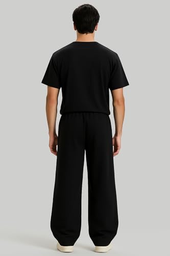 Image of Aesthetic Gothic Wide Leg Pants for Men | Tribal Print Baggy Streetwear | Oversized Track Pants with Elastic Waist | Black and White Relaxed Fit Bottoms
