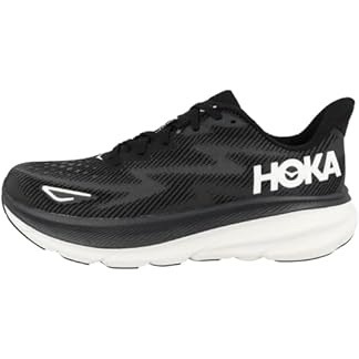 A single HOKA Men’s Clifton 9 Running Shoe in black, shown from a side profile. The shoe features the HOKA logo in white on the side, a white midsole, and a textured black upper with geometric patterns, set against a transparent background.