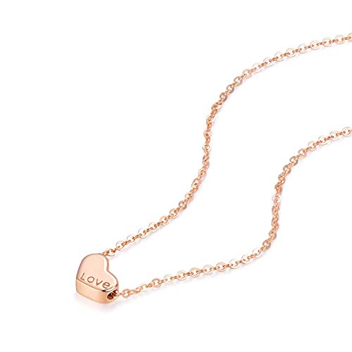 Collier coeur en or rose gravé d'amour : le serment d'une vie gravé sur un bijou de mariée