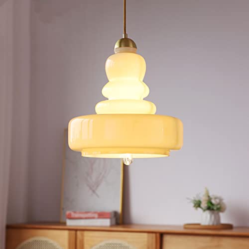 Luminaire suspendu en verre de lait blanc pour créer un cocon doux dans la chambre