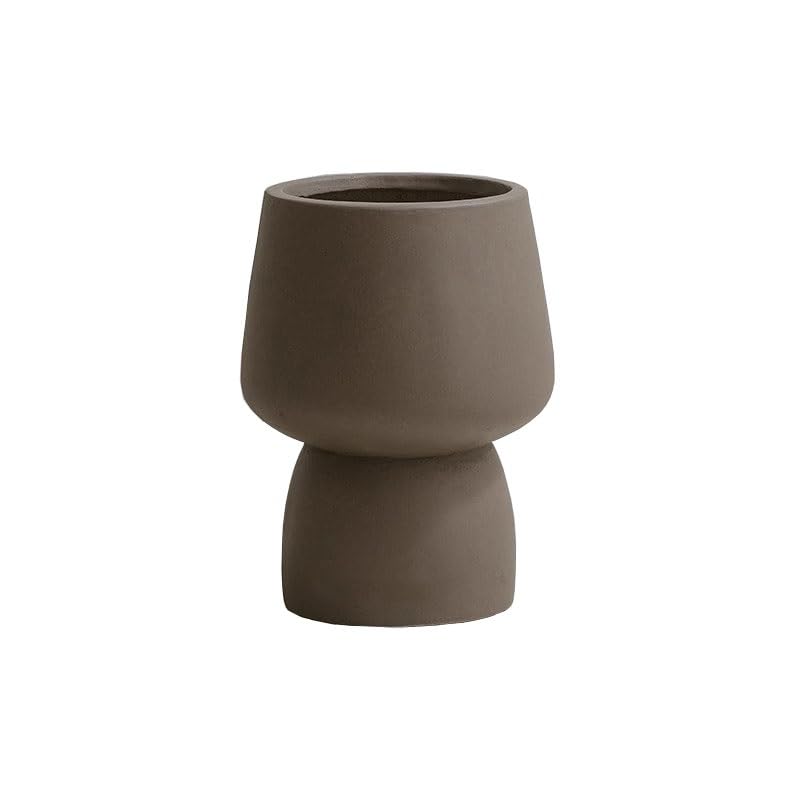 Pot de fleurs avec trous de drainage pour éviter les racines pourries en salon