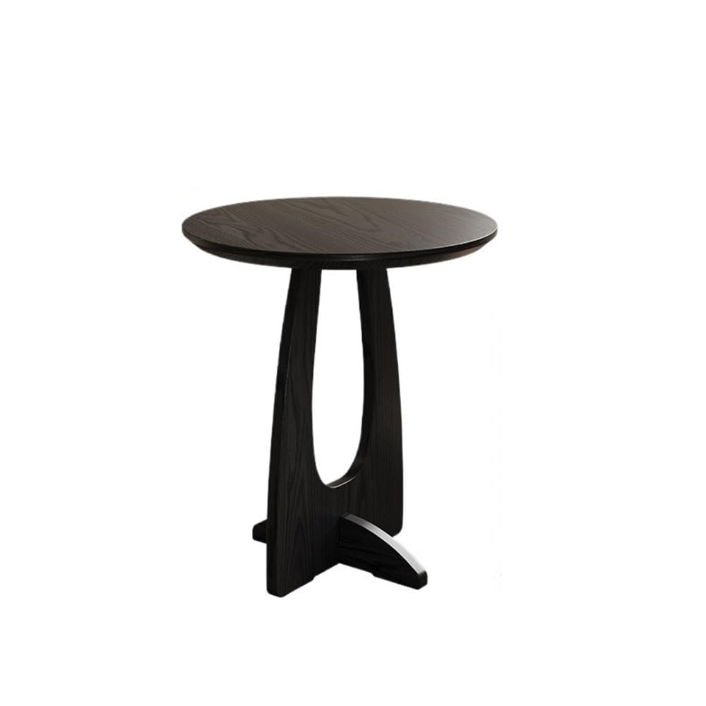 Table d'appoint ronde en bois noir pour créer un coin lecture chaleureux dans le salon