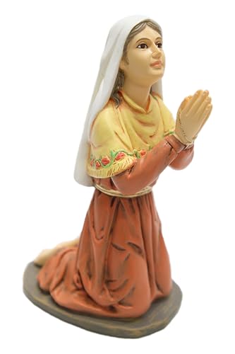 Estatua de San Bernadette de Lourdes en oración blanca