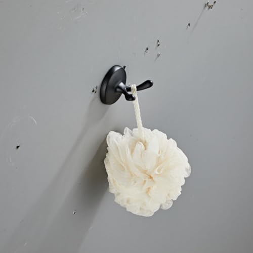 Support serviette mural noir pour une salle de bain moderne et ordonnée