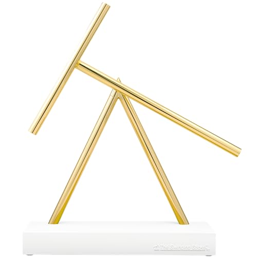 The white/gold premium edition looks like a museum-grade kinetic sculpture — hard to believe it lives on a desk and runs on a battery.