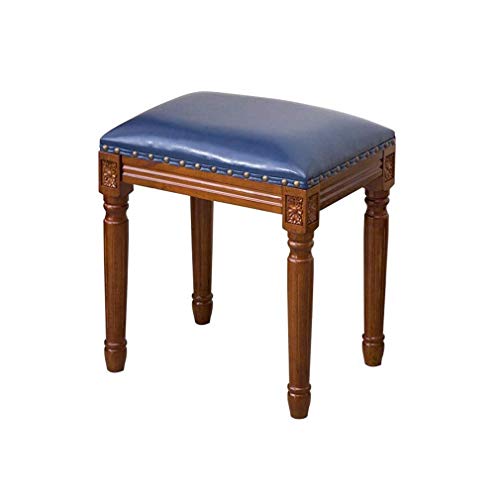 Tabouret de courtoisie en bois bleu autour de la table de repas