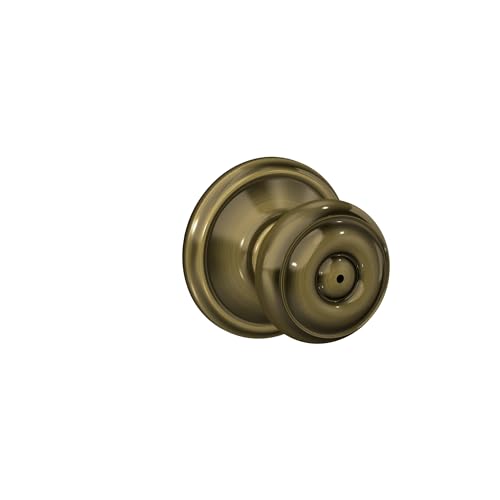 Image of Schlage F40 GEO 609 Georgian Door Knob, Bed & Bath Privacy Lock, Antique Brass
