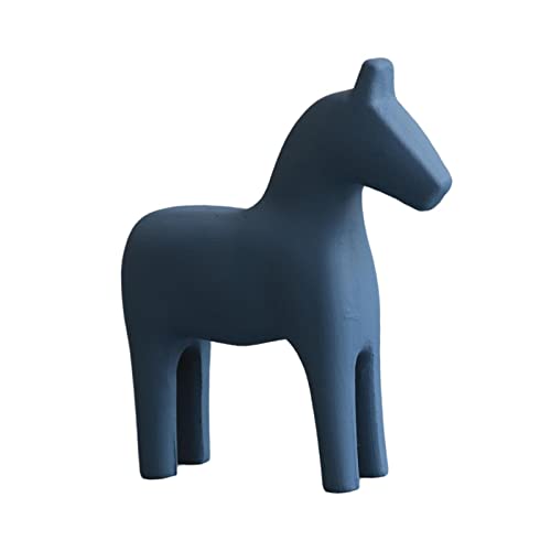 Art décoratif moderne avec cette statuette en bois bleu