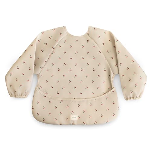 Image of mushie Long Sleeve Baby Bib | Water Resistant Adjustable Fit for Ages 6-24 Months