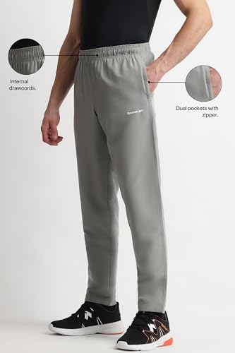 Image of Reebok Men's Woven Mesh Track Pants - Breathable Mesh Panels Gym Trackpants for Men | Training Running Payjama for Men | Athletic Pants - Elastic Drawcord Waistband