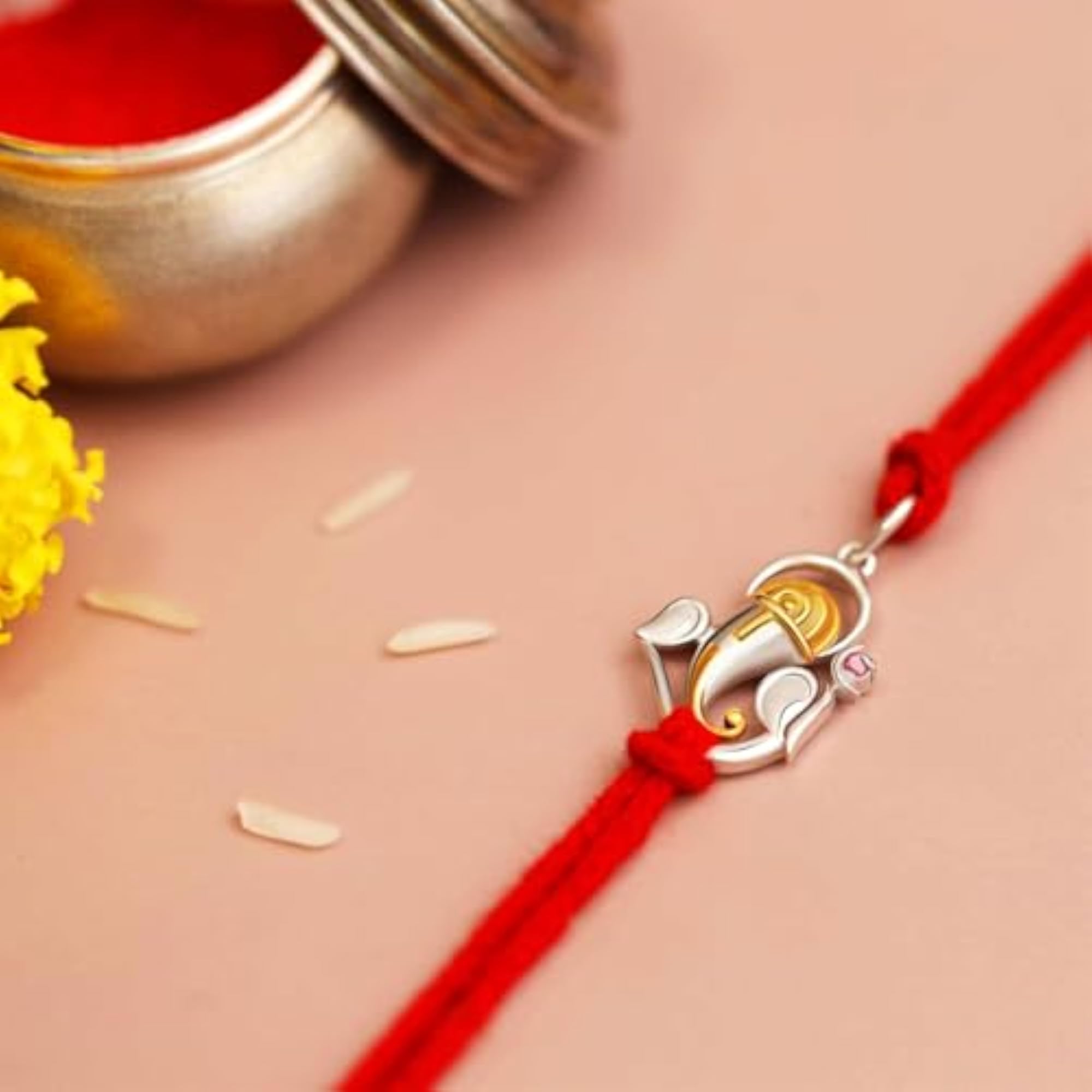 Silver Rakhi with Ganesha Ruby Studded Bracelet for Raksha Bandhan