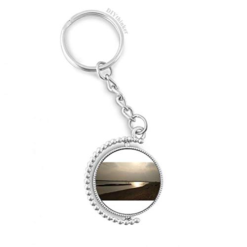 Llavero de cadena rotativo de atardecer en la playa, el detalle ideal para viajeros