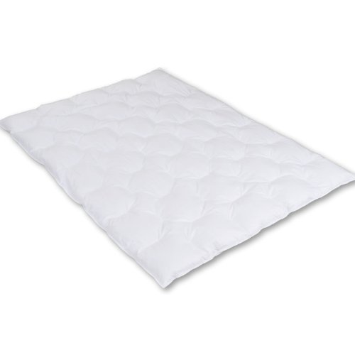 Couette enfant duvet d'oie pour des nuits d'hiver sereines