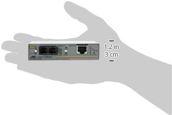 Allied Telesis AT-MC102XL-90 Media Converter held in hand for scale