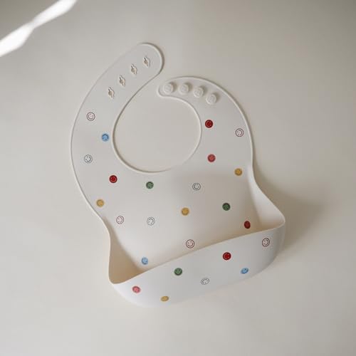 Image of mushie Silicone Baby Bib | Adjustable Fit Waterproof Bibs (Smiley Face)