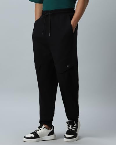 Image of Bewakoof Men's Cotton Super Loose Fit Joggers|Bewakoof Air 1.0 | Track pants for man | Lower for man | Trouser for men | Baggy trackpants for men | Multipurpose | Mens Lower Activewear | Utility Pockets | Lightweight & Flexible Elastic Waist | Casual Joggers | Loose Fit