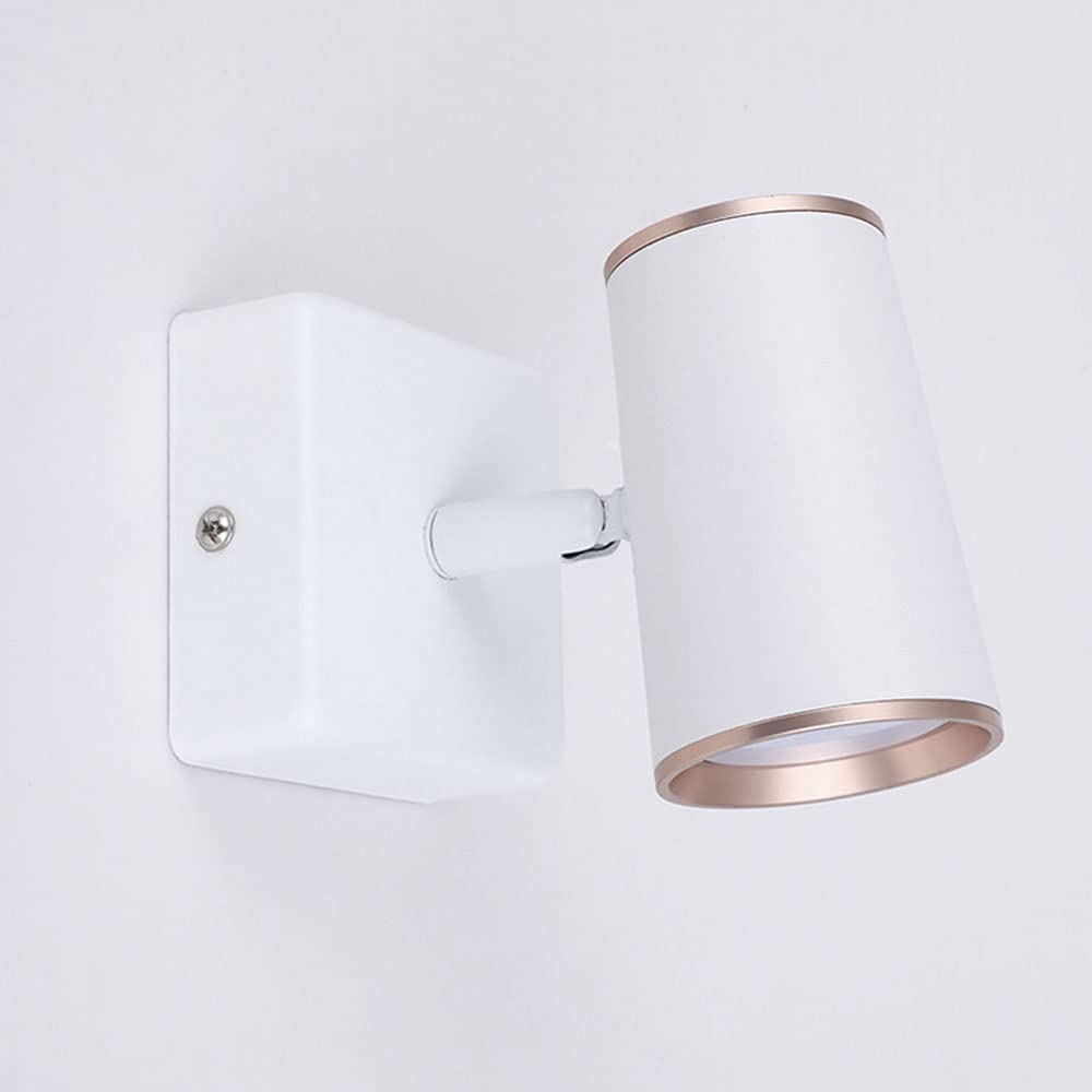 Lámpara de lectura junto a la cama para crear un ambiente acogedor de hotel en casa