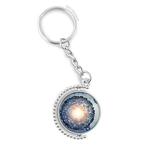 Llavero azul de células de ciencias cosmicas con anillo giratorio